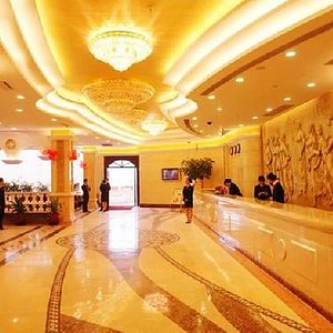Vienna Hotel (Shenzhen Aiguo) in Shenzhen, image may contain: Indoors, Floor, Foyer, Person