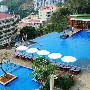 Royal Garden Resort in Sanya, image may contain: Hotel, Resort, Building, Pool