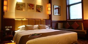 Beijing Minzu Hotel in Beijing, image may contain: Hotel, Resort, Furniture, Dorm Room