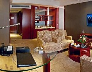 Jinyuan Sunshine Hotel in Changsha, image may contain: Furniture, Bedroom, Bed, Person