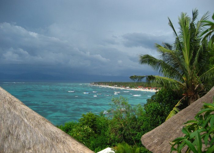 A view over the seaweed fields of Lembongan.  Bali on the horizon