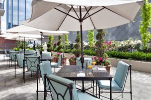 L'Hermitage Hotel in Vancouver, image may contain: Terrace, Dining Table, Table, Chair
