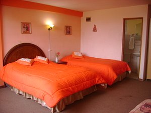 Hotel Villafuerte in Oruro, image may contain: Furniture, Bed, Bedroom, Sink