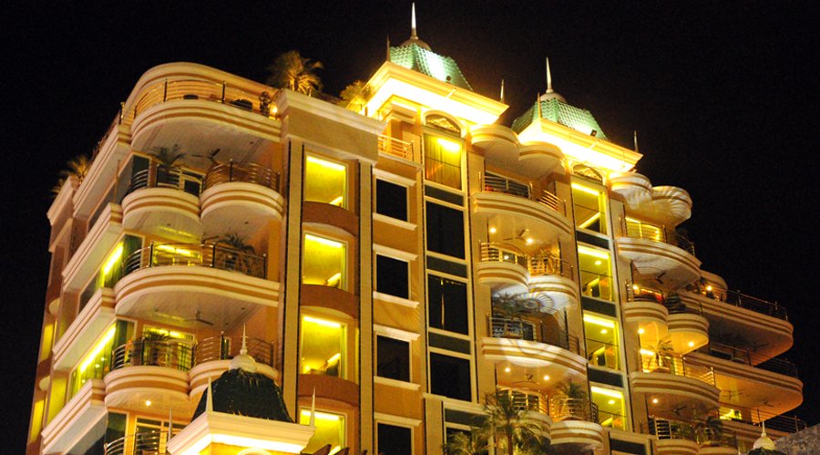 FPS condo-hotel facade at night