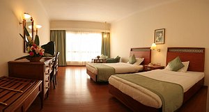 Hotel Avenue Regent in Kolkata (Calcutta), image may contain: Furniture, Bedroom, Bed, Flooring