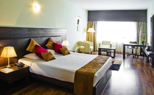 The Woodrose in Bengaluru, image may contain: Table Lamp, Lamp, Hotel, Home Decor