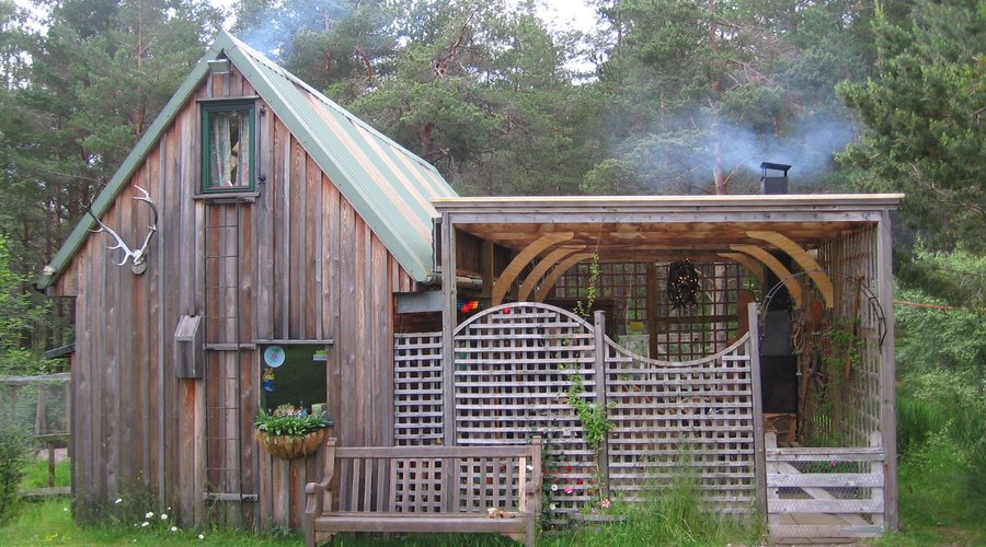 with both the indoor jotul stove and outdoor fireplace lit