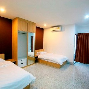 A Twin Bedroom : Two comfortable single-beds room with private bathroom and balcony.