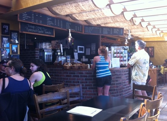 Muddy Waters bar with plethora of baked goodies and a large menu of coffees and other drinks