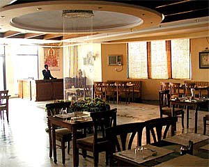 Hotel The Royal Residency in Aligarh, image may contain: Restaurant, Dining Room, Dining Table, Cafe