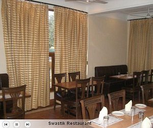 Hotel The Shubham in Vrindavan, image may contain: Dining Room, Dining Table, Table, Restaurant