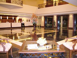 Majestic Grand Hotel in Jalandhar, image may contain: Flooring, Floor, Lighting, Potted Plant