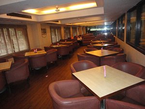 Rituraj Hotel in Kolkata (Calcutta), image may contain: Restaurant, Indoors, Lounge, Furniture