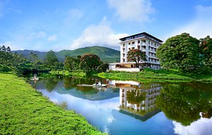 Westwood Riverside Garden Resorts in Munnar, image may contain: Hotel, Resort, Scenery, Pond