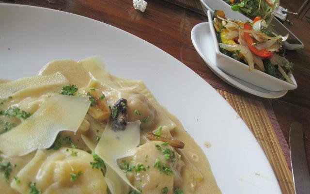 Pumpkin ravioli with shavings of Parmesan, roasted vegetable salad
