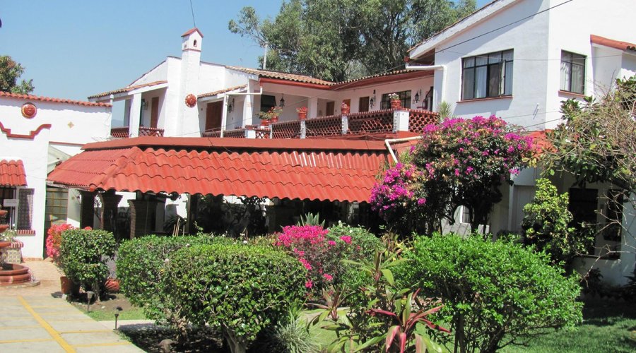 Garden and buildings of small family run hotel