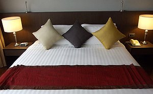 Royal Suite Hotel Bangkok in Bangkok, image may contain: Cushion, Home Decor, Lamp, Linen