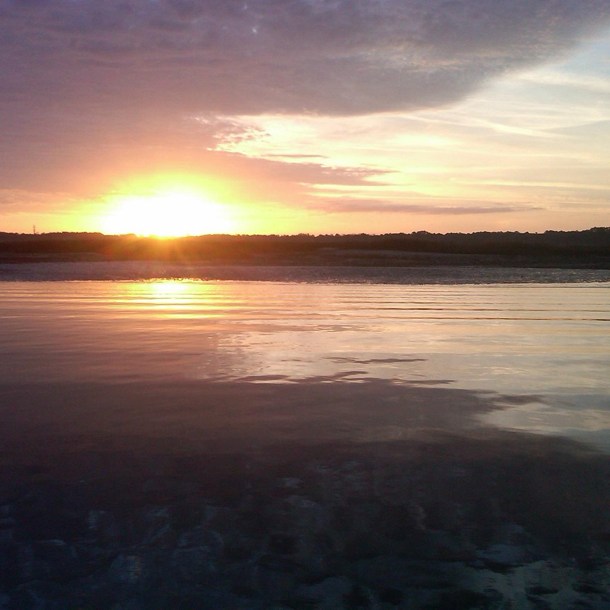 Quiet sunrise on Hilton Head Island Island SC, surf fishing pole