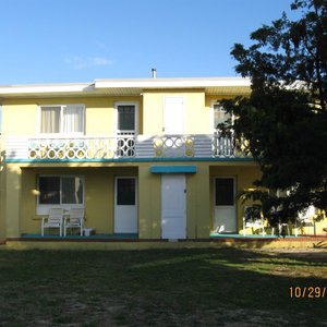 The back of the apartments: the private porch with chairs