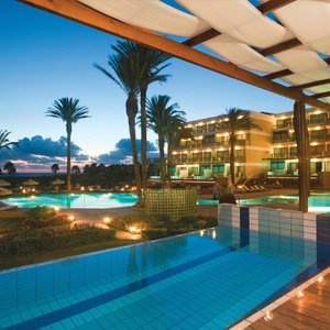 Constantinou Bros Asimina Suites Hotel in Geroskipou, image may contain: Hotel, Resort, Pool, Water