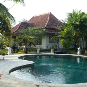 pool with villa in the back ground