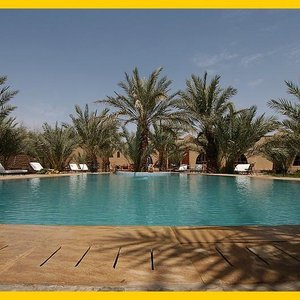 a big swimming pool in the centre of the guest house.