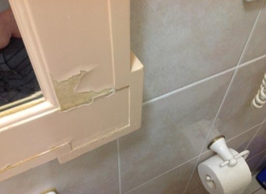 flaking paint on bathroom mirror
