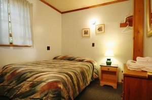 Elmwood Motor Court in Old Orchard Beach, image may contain: Furniture, Bed, Dorm Room, Bedroom