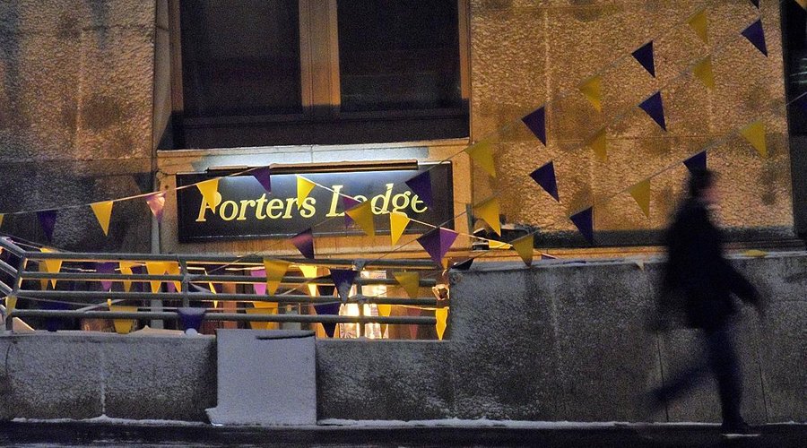 Porters lodge outside on a snowy night
