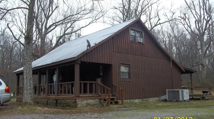                   Front porch view of Rustic Cabin at Barren Creek
                