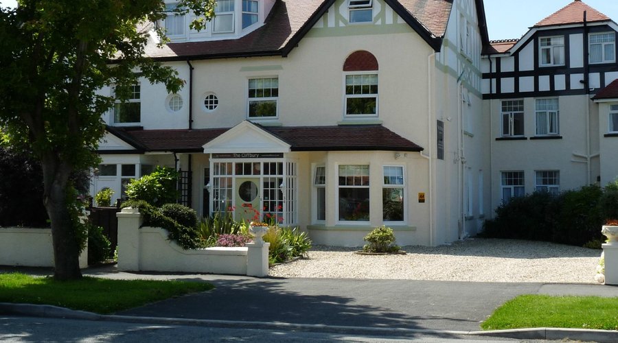 Front of the house showing the gravelled parking area for up to 6 cars