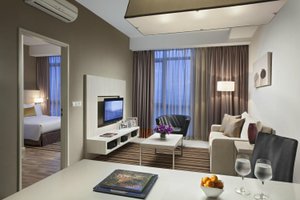 Citadines Uplands Kuching in Kuching, image may contain: Living Room, Interior Design, Table, Couch