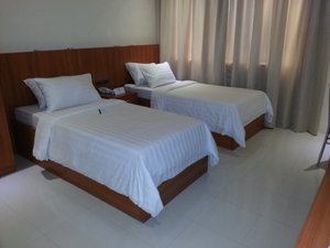 Parkway Hotel Surigao in Mindanao, image may contain: Bed, Furniture, Bedroom, Room