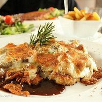 Schnitzel with mushrooms and grilled cheese