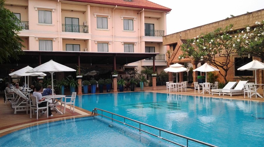 Lovely private courtyard swimming pool with lovely sculptures