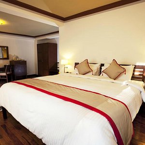 Shambaling Boutique Hotel in Kathmandu, image may contain: Bed, Furniture, Bedroom, Indoors