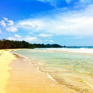Red Frog Beach. Take sunscreen. And try surfing!