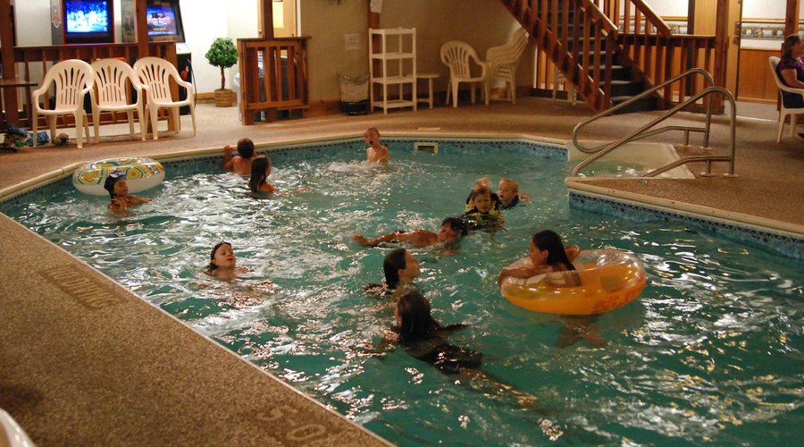 Kids playing the pool