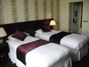 Cabot Court Hotel in Weston super Mare, image may contain: Table Lamp, Lamp, Furniture, Bed
