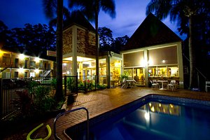 Sanctuary Resort Motor Inn in Coffs Harbour, image may contain: Resort, Hotel, Building, Villa