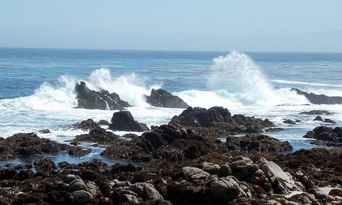 waves crash into the rocks