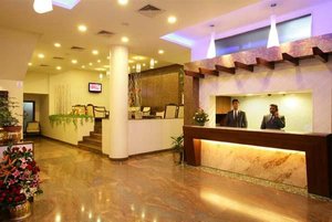 Hotel Utsav Deluxe in Pune, image may contain: Foyer, Indoors, Reception, Floor