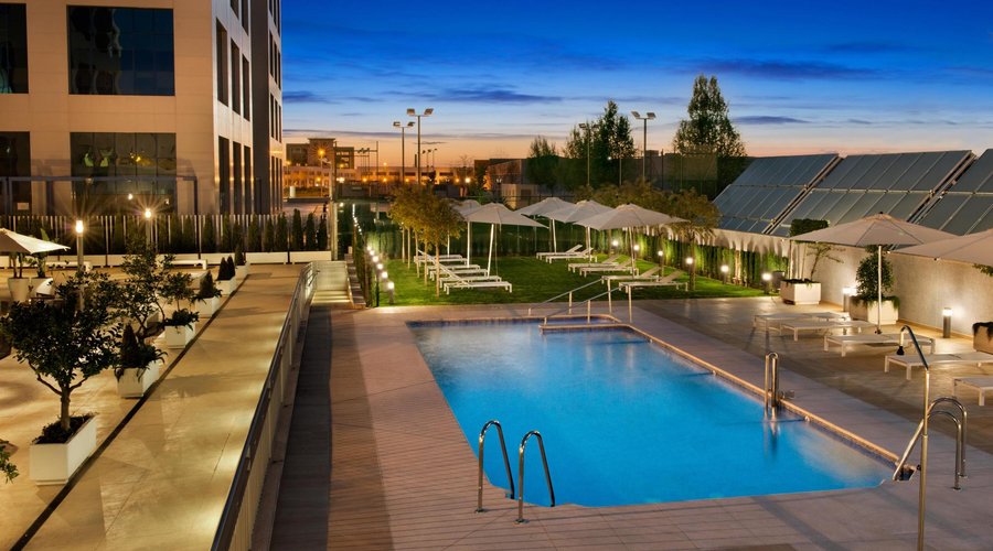 Outdoor pool and solarium by night