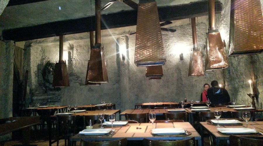 Cozy interior with grills on tables (charbonnade)