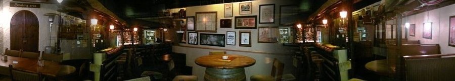Our bar wall filled with old menu's and pictures