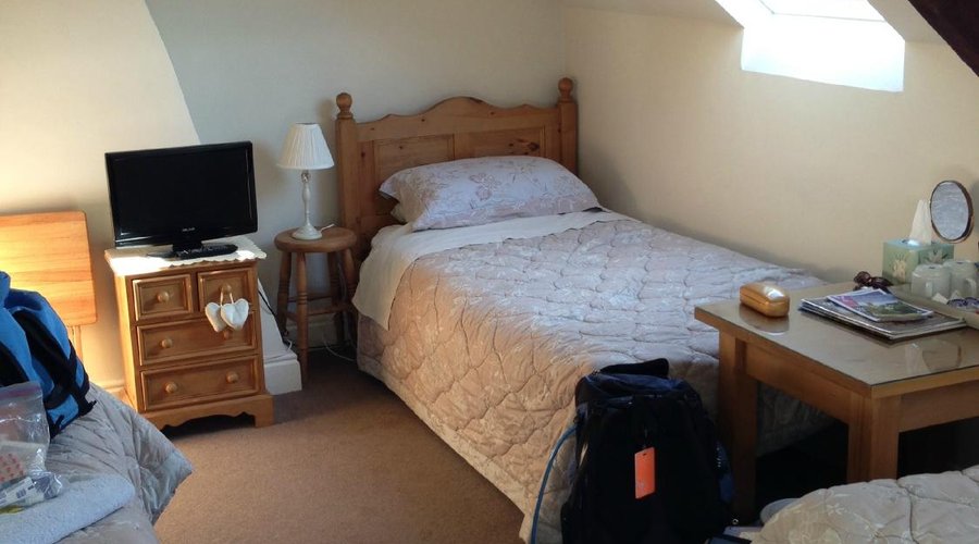 room has 4 twin beds