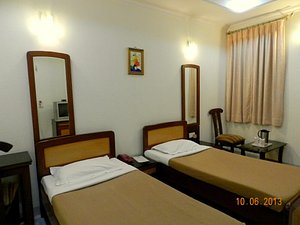 Hotel Tara Palace Chandni Chowk in New Delhi, image may contain: Chair, Bed, Hostel, Monitor