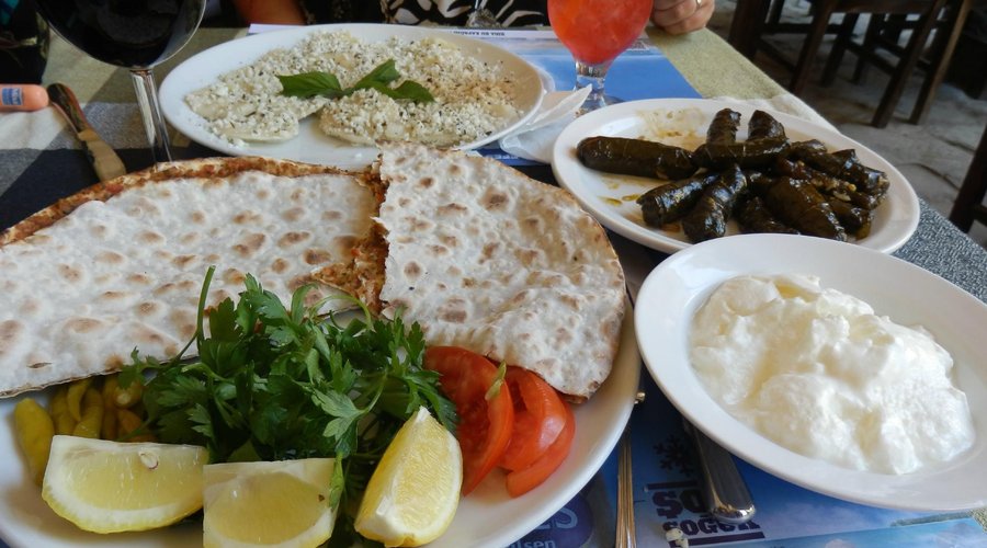 Turkish raviolis, Turkish pizza, stuffed wine leaves, yogurt