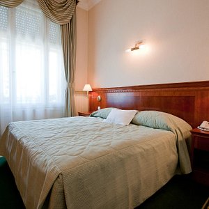 Hotel Waldinger in Osijek, image may contain: Furniture, Bedroom, Bed, Indoors