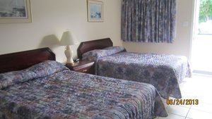 Stardust Motel Timberlea in Timberlea, image may contain: Hotel, Bed, Furniture, Lamp